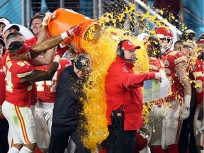 Feb 2, 2020; Miami Gardens, Florida, USA; Kansas City Chiefs head coach Andy Reid is dunked with Gatorade by his players Jordan Lucas (24) and Cameron Erving (75) in the fourth quarter against the San Francisco 49ers in Super Bowl LIV at Hard Rock Stadium. Mandatory Credit: Geoff Burke-USA TODAY Sports