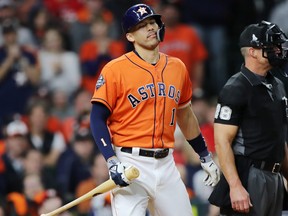 Astros' Carlos Correa reacts after striking out against the Washington Nationals during the eighth inning in Game 7 of the 2019 World Series at Minute Maid Park on Oct. 30 in Houston.