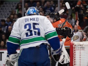 Anaheim Ducks' Derek Grant, back right, and Ryan Getzlaf celebrate Grant's goal against Vancouver Canucks goalie Thatcher Demko during the first period of an NHL hockey game in Vancouver, on Sunday, February 16, 2020.