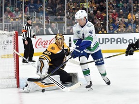 Elias Pettersson seemed no worse for wear after a hit by the Bruins' Matt Grzelcyk, but later had to miss game action because of it.