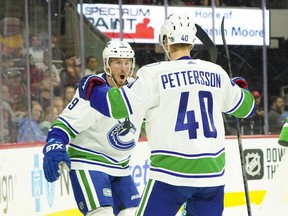 Canucks winger J.T. Miller looks suitably impressed after his linemate Elias Pettersson scored the second of his two goals of the game from near the end goal line during Sunday's NHL game against the Carolina Hurricanes at PNC Arena in Raleigh, N.C.