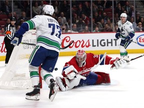 Canucks right wing Tyler Toffoli (73) scores a goal against Montreal Canadiens goaltender Carey Price (31) during an overtime period at Bell Centre.