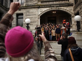Protesters in support of Wet'suwet'en hereditary chiefs block the entrance to the library at the B.C. legislature before the throne speech in Victoria on Tuesday.