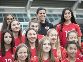 Christine Sinclair with teen soccer players — and fans of her’s — outside the B.C. Sports Hall of Fame.