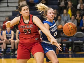 Lily Pink of the Okanagan Mission Huskies battles for the ball against the Abbotsford Panthers in Saturday's Triple A girls' provincial basketball championship game at Langley Events Centre. Abbotsford won 85-77.