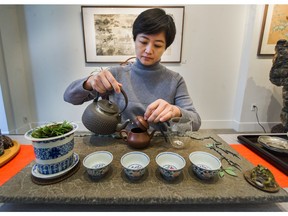 VANCOUVER, B.C.: February 17, 2020 – Wang Lu pours tea inside Sunzen Art Gallery in Vancouver, B.C. on February 17, 2020. Sunzen Art Gallery, a gallery specializing in fine Chinese art and cultural collector pieces, is hosting a by-donation Chinese tea ceremony on Sunday, Feb. 23 to fight back against fear and racism in light of the coronavirus spread.