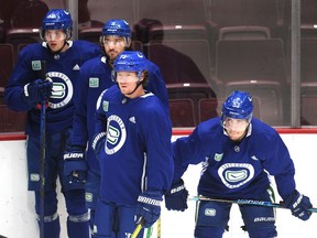 New Canuck Tyler Toffoli, right, acquired in a trade with the Los Angeles Kings, works out with his new Vancouver teammates on Tuesday at Rogers Arena.