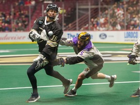 Mitch Jones (left, in action for the Warriors in December 2019) was second in NLL scoring with 74 points in just 13 games when the league suspended operations in March of last year because of the COVID-19 pandemic.