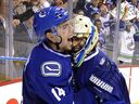 Roberto Luongo and Alex Burrows celebrate advancing to the 2011 Stanley Cup final.