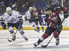 Giants defenceman Alex Kannok Leipert plays keep-away with the puck as Victoria Royals winger Ty Yoder is in pursuit during last spring’s playoff series between the two clubs. Both are still with their respective teams as this weekend’s crucial three-game set looms.