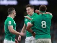 Ireland players celebrate a turnover against Wales at the Rugby Union - Six Nations Championship on Feb. 8 in this file photo. An upcoming fixture against coronavirus-hit Italy has been postponed.