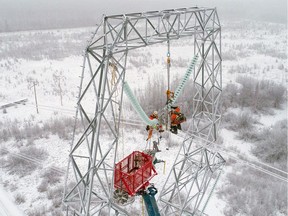 Power line technicians work on the new lines serving the Site C dam project.