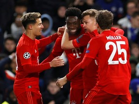 Soccer Football - Champions League - Round of 16 First Leg - Chelsea v Bayern Munich - Stamford Bridge, London, Britain - February 25, 2020  Bayern Munich's Philippe Coutinho, Alphonso Davies, Joshua Kimmich and Thomas Muller celebrate their third goal   REUTERS/Eddie Keogh