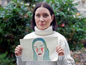 Natalie Boll, holding a picture her daughter drew, at her home on Dec. 17, 2019. Boll alleges her daughter was a victim of bullying at Crofton House School in Vancouver.
