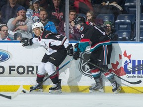 Giants defenceman Alex Kannok Leipert (left) battles along the boards with   centre Ethan Ernst of the Kelowna Rockets during a WHL game last season in Kelowna.