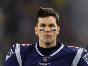 Tom Brady of the New England Patriots reacts from the sidelines as they take on the Tennessee Titans in the second quarter of the AFC Wild Card Playoff game at Gillette Stadium on January 04, 2020 in Foxborough, Massachusetts.