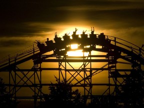 PNE photographer Craig Hodge's photo of riders on the wooden roller-coaster at sunset in 2006.