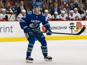 Canucks centre Elias Pettersson follows the play during the first NHL regular season game of his career against the Calgary Flames at Rogers Arena on Oct. 3, 2018.