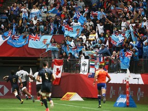 Fans celebrate and wave Fijian flags during a Fiji-Argentina match at last year’s Canada Sevens international tournament at B.C. Place Stadium. Officials at the Vancouver sports venues that draw huge crowds are monitoring the COVID-19 coronavirus situation closely.