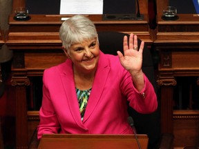Minister of Finance Carole James waves to people in the sitting area before she delivers her budget speech from the legislative assembly at B.C. Legislature in Victoria, B.C., on Tuesday, Feb. 18, 2020.