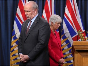 Premier John Horgan and Minister of Finance Carole James discuss the next steps of the COVID-19 action plan recently put in place by the provincial government during a press conference at Legislature in Victoria, B.C., on Monday, February 23, 2020.