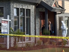 Police investigate the murder of real estate agent Lindsay Buziak at a Saanich House in 2008.