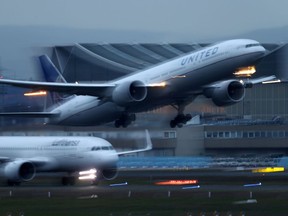 Airplanes of German Carrier Lufthansa and United Airlines land and take off at Frankfurt Airport, Germany March 2, 2020. REUTERS/Kai Pfaffenbach