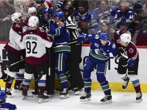 A fight breaks out during the March 6 game between the Vancouver Canucks and the Colorado Avalanche during the third period at Rogers Arena