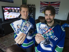 Vancouver super fans Adam McPhee, left, and Jimmi Karvelis were mourning the possible end of the Canucks' season on Saturday in Vancouver.
