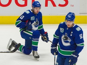 VANCOUVER, BC - March 4, 2020  - Vancouver Canucks Quinn Hughes (left) in pre-game skate prior to a game vs Arizona Coyotes during NHL action at Rogers Arena in Vancouver, BC, March 4, 2020.   (Arlen Redekop / PNG staff photo) (story by reporter) [PNG Merlin Archive]