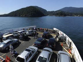 A B.C. ferry approaches Bowen Island, which will be the scene of a TransLink trial of on-demand bus services.