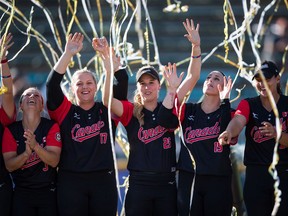 Canada's Erika Polidori, from left to right, Sara Groenewegen, Larissa Franklin, Danielle Lawrie and Eujenna Caira celebrate after defeating Brazil during playoff action at the Softball Americas Olympic Qualifier tournament in Surrey on Sunday, Sept. 1, 2019. With the win Canada qualified for the 2020 Tokyo Olympics.
