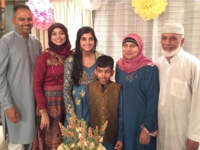 The Khan family in their Burnaby home on the Muslim holiday of Eid al-Fitr, which marks the end of the month-long Ramadan fast, in 2019. This year the coronavirus pandemic will prevent the family from celebrating with their community. From left: Shaheem, his wife, Nasreen, daughter Nylah, son Shoayb and Shaheem's parents, Mehtab and Aslam.