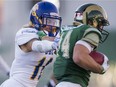 UBC Thunderbirds Stavros Katsantonis (left) runs down University of Regina Rams Ryan Schienbein during U Sports Canada West playoff football action at Mosaic Stadium at Taylor Field, Regina, SK, November, 5, 2016.