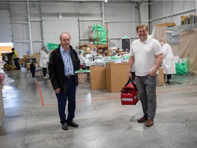 Surrey Mayor Doug McCallum with Dan London, president of Surrey-based Firetech Manufacturing. Firetech retooled part of its operations to manufacture disposable face shields for health authorities during the COVID-19 pandemic.