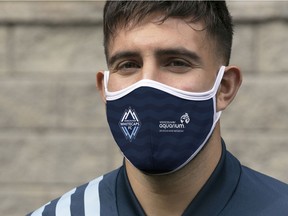 Vancouver Whitecaps striker Lucas Cavallini models a face mask the team is selling, with funds to support the Vancouver Aquarium. [PNG Merlin Archive]