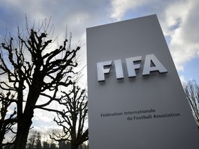 A sign of FIFA is seen at the soccer's world governing body headquarters in Zurich, Switzerland.