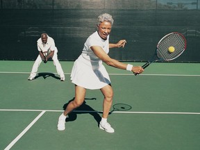 Seniors playing tennis.