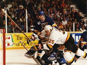 Jim Sandlak of the Vancouver Canucks wasn't afraid of the rough going — or crashing into the St. Louis Blues when he played against them in 1991.
