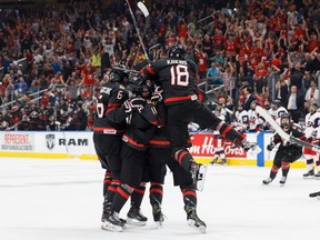 Canada celebrates the game-tying goal during third period Hlinka Gretzky Cup semifinal action against the United States, in Edmonton on Friday, August 10, 2018.