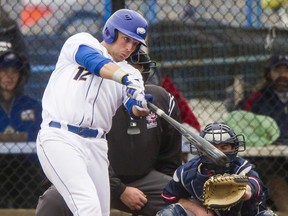 UBC Thunderbirds first baseman Bruce Yari delivers a hit during a NAIA West baseball game against the Lewis-Clark State Warriors in March 2016 at Thunderbird Park on the UBC campus. Yari tested the baseball dimensions of B.C. Place Stadium in 2014 with some trial swings.