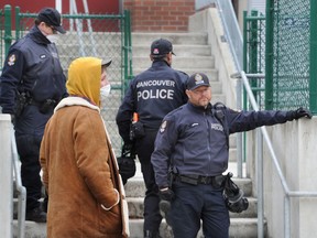 Vancouver Police on scene as a number of homeless people in the Downtown Eastside occupied an empty part of Lord Strathcona Elementary School.