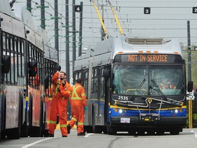 Rows of buses at the Marpole Bus Yard as TransLink slashes service, temporarily lays off almost 1,500 staff and cuts executive pay in order to try and stem revenue losses caused by the COVID-19 pandemic, in Vancouver on April 20, 2020.