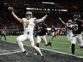 Saints quarterback Taysom Hill (7) scores a rushing touchdown in the second quarter against the Falcons at Mercedes-Benz Stadium in Atlanta, Nov. 28, 2019.