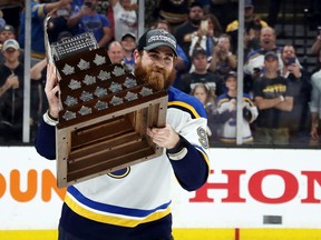 Ryan O'Reilly of the St. Louis Blues celebrates with the Conn Smythe Trophy after defeating the Boston Bruins 4-1 to win Game 7 of the 2019 NHL Stanley Cup Final in Boston on June 12.