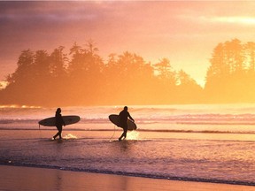 Surfers at Chesterman Beach in Tofino.