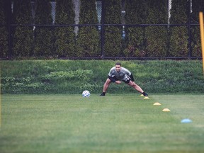 Whitecaps left back Ali Adnan stretches on May 12, the first training session back for the team since the league went into COVID-19 lockdown.