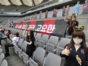 In a photo taken on May 17, 2020 mannequins are displayed at a FC Seoul football match in Seoul. - South Korean football club FC Seoul apologized May 18, 2020 after reports that it had used sex dolls to fill up its empty stands during a game at the weekend.