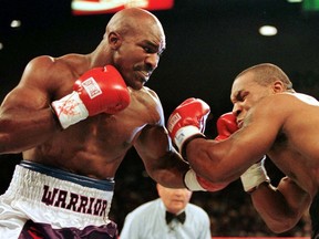 WBA Heavyweight Champion Evander Holyfield (left) connects to the jaw of challenger Mike Tyson in their June 28, 1997 rematch bout in Las Vegas.