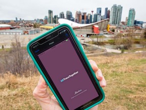 The Alberta government's ABTraceTogether tracing app for COVID-19 is shown against the Calgary skyline.